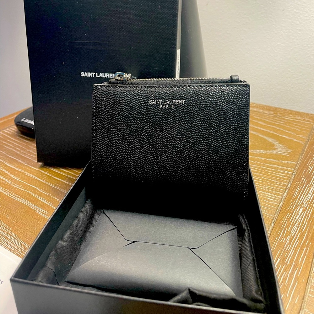 This is a brand new small St Laurent pebbled leather billfold and card case.